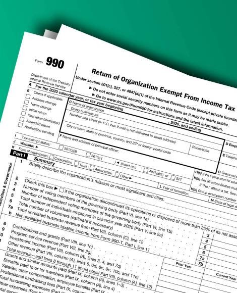 Form 990 papers. Return of Organization Exempt From Income Tax. Form 990 documentation published IRS USA 12.22.2020. American tax document on colored